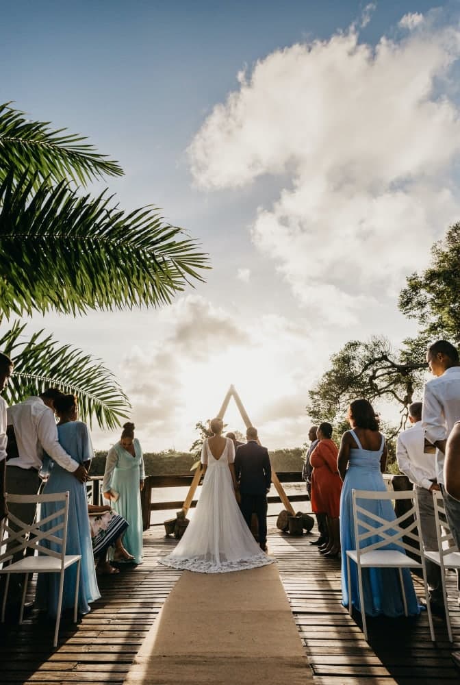 Ceremony aisle styled with a simple arch at golden hour